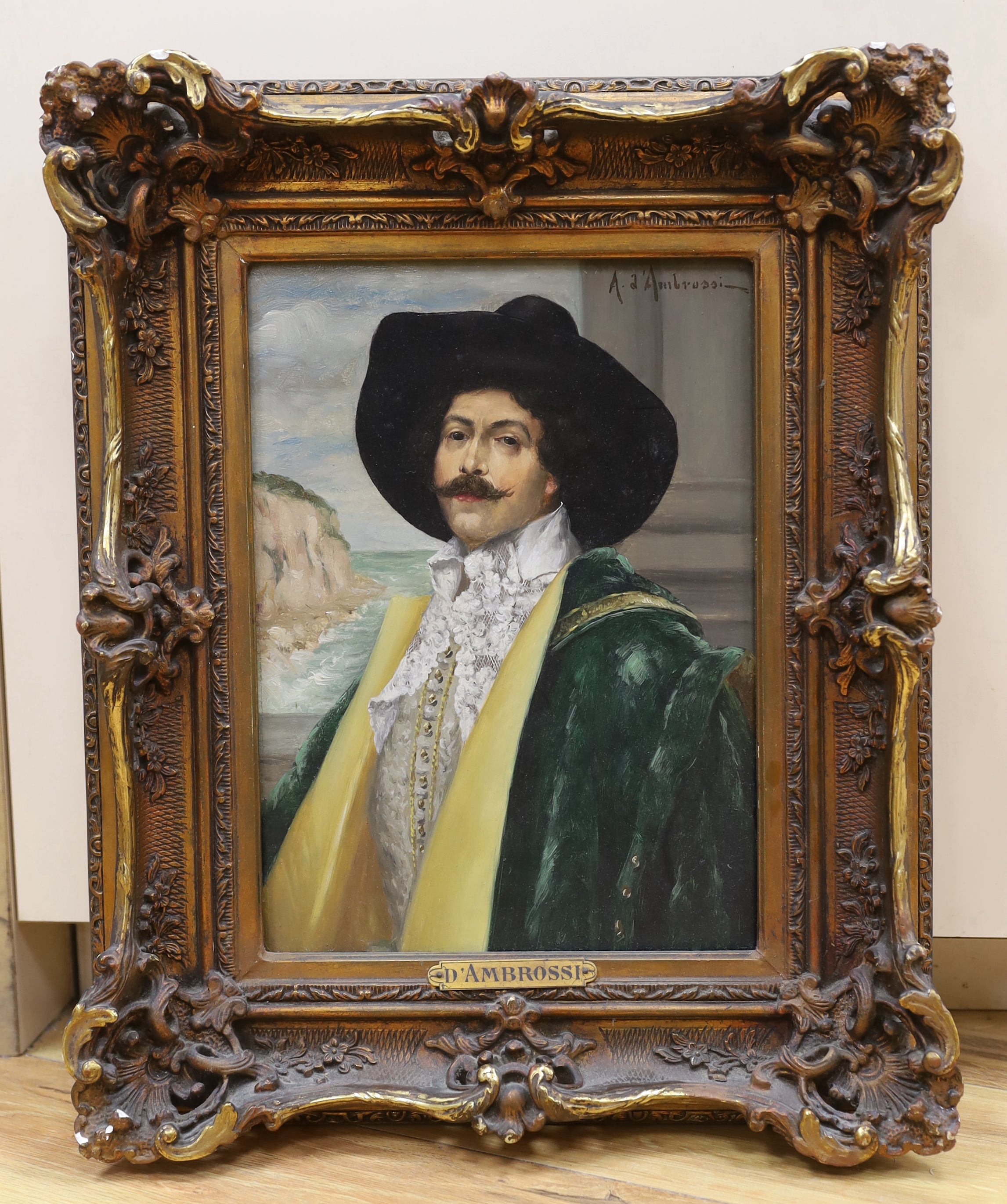 Alexis d’Ambrossi (Italy,19/20C), oil on board, Portrait of a Cavalier before a coastal scene, signed, applied plaque to the frame, 31 x 22cm, ornate gilt framed